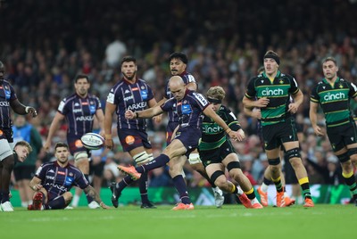 240525 - Northampton Saints v Union Bordeaux-Begles, EPCR Champions Cup Final - Maxime Lucu of Union Bordeaux-Begles kicks ahead