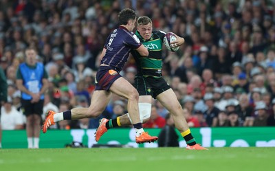 240525 - Northampton Saints v Union Bordeaux-Begles, EPCR Champions Cup Final - Tom Litchfield of Northampton Saints takes on Damian Penaud of Union Bordeaux-Begles