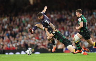 240525 - Northampton Saints v Union Bordeaux-Begles, EPCR Champions Cup Final - Matthieu Jalibert of Union Bordeaux-Begles is tackled as he goes to kick