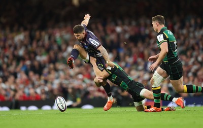 240525 - Northampton Saints v Union Bordeaux-Begles, EPCR Champions Cup Final - Matthieu Jalibert of Union Bordeaux-Begles is tackled as he goes to kick