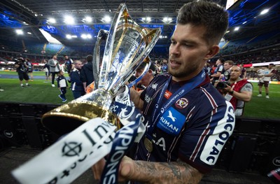240525 - Northampton Saints v Union Bordeaux-Begles, EPCR Champions Cup Final - Matthieu Jalibert of Union Bordeaux-Begles celebrates with the trophy as they win the Investec Champions Cup