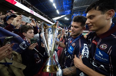 240525 - Northampton Saints v Union Bordeaux-Begles, EPCR Champions Cup Final - Matthieu Jalibert of Union Bordeaux-Begles celebrates with the trophy as they win the Investec Champions Cup
