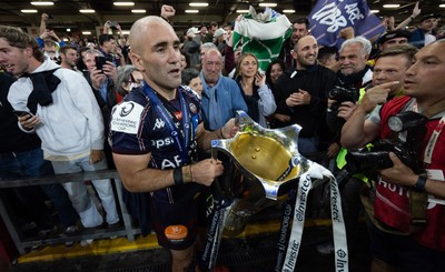 240525 - Northampton Saints v Union Bordeaux-Begles, EPCR Champions Cup Final - Maxime Lucu of Union Bordeaux-Begles celebrates with the trophy as they win the Investec Champions Cup