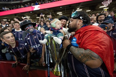 240525 - Northampton Saints v Union Bordeaux-Begles, EPCR Champions Cup Final - Ben Tameifuna of Union Bordeaux-Begles celebrates with the trophy and family as they win the Investec Champions Cup