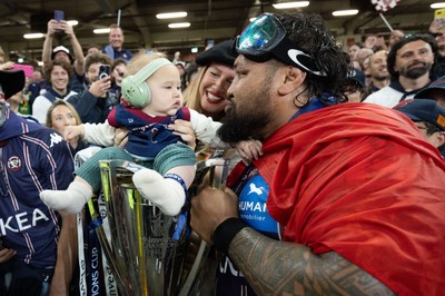 240525 - Northampton Saints v Union Bordeaux-Begles, EPCR Champions Cup Final - Ben Tameifuna of Union Bordeaux-Begles celebrates with the trophy and family as they win the Investec Champions Cup