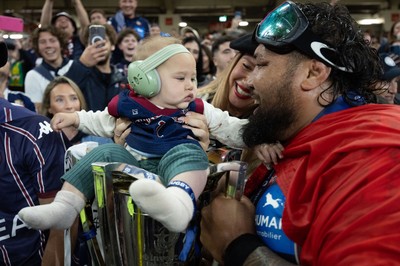 240525 - Northampton Saints v Union Bordeaux-Begles, EPCR Champions Cup Final - Ben Tameifuna of Union Bordeaux-Begles celebrates with the trophy and family as they win the Investec Champions Cup