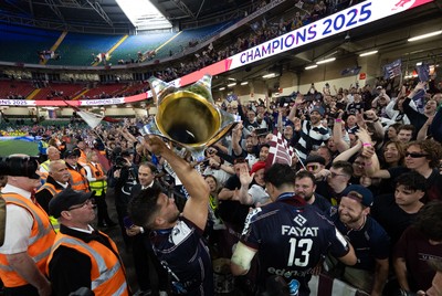 240525 - Northampton Saints v Union Bordeaux-Begles, EPCR Champions Cup Final - Matthieu Jalibert of Union Bordeaux-Begles celebrates with the trophy and fans as they win the Investec Champions Cup
