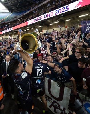240525 - Northampton Saints v Union Bordeaux-Begles, EPCR Champions Cup Final - Matthieu Jalibert of Union Bordeaux-Begles celebrates with the trophy and fans as they win the Investec Champions Cup