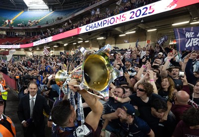 240525 - Northampton Saints v Union Bordeaux-Begles, EPCR Champions Cup Final - Matthieu Jalibert of Union Bordeaux-Begles celebrates with the trophy and fans as they win the Investec Champions Cup