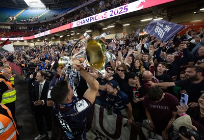 240525 - Northampton Saints v Union Bordeaux-Begles, EPCR Champions Cup Final - Matthieu Jalibert of Union Bordeaux-Begles celebrates with the trophy and fans as they win the Investec Champions Cup