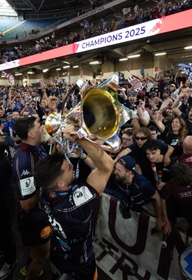 240525 - Northampton Saints v Union Bordeaux-Begles, EPCR Champions Cup Final - Matthieu Jalibert of Union Bordeaux-Begles celebrates with the trophy and fans as they win the Investec Champions Cup