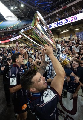 240525 - Northampton Saints v Union Bordeaux-Begles, EPCR Champions Cup Final - Matthieu Jalibert of Union Bordeaux-Begles celebrates with the trophy and fans as they win the Investec Champions Cup