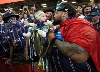 240525 - Northampton Saints v Union Bordeaux-Begles, EPCR Champions Cup Final - Ben Tameifuna of Union Bordeaux-Begles celebrates with the trophy and family as they win the Investec Champions Cup