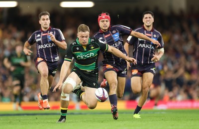 240525 - Northampton Saints v Union Bordeaux-Begles, EPCR Champions Cup Final - Tom Litchfield of Northampton Saints beats Louis Bielle-Biarrey of Union Bordeaux-Begles to the ball