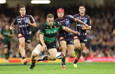 240525 - Northampton Saints v Union Bordeaux-Begles, EPCR Champions Cup Final - Tom Litchfield of Northampton Saints beats Louis Bielle-Biarrey of Union Bordeaux-Begles to the ball