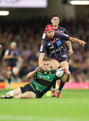240525 - Northampton Saints v Union Bordeaux-Begles, EPCR Champions Cup Final - Tom Litchfield of Northampton Saints beats Louis Bielle-Biarrey of Union Bordeaux-Begles to the ball