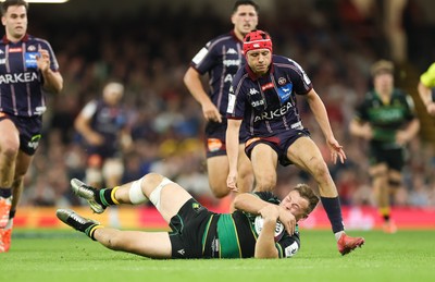 240525 - Northampton Saints v Union Bordeaux-Begles, EPCR Champions Cup Final - Tom Litchfield of Northampton Saints beats Louis Bielle-Biarrey of Union Bordeaux-Begles to the ball