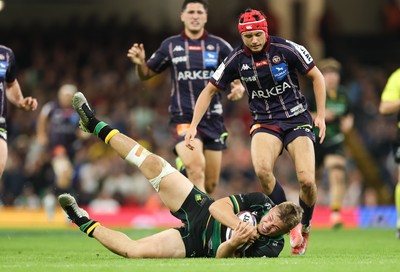 240525 - Northampton Saints v Union Bordeaux-Begles, EPCR Champions Cup Final - Tom Litchfield of Northampton Saints beats Louis Bielle-Biarrey of Union Bordeaux-Begles to the ball