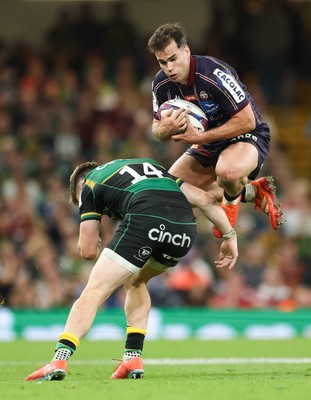 240525 - Northampton Saints v Union Bordeaux-Begles, EPCR Champions Cup Final - Damian Penaud of Union Bordeaux-Begles takes the ball as Tommy Freeman of Northampton Saints closes in
