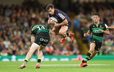 240525 - Northampton Saints v Union Bordeaux-Begles, EPCR Champions Cup Final - Damian Penaud of Union Bordeaux-Begles takes the ball as Tommy Freeman of Northampton Saints closes in