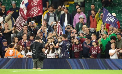 240525 - Northampton Saints v Union Bordeaux-Begles, EPCR Champions Cup Final - Marko Gazzotti of Union Bordeaux-Begles lifts the trophy as he celebrates with fans