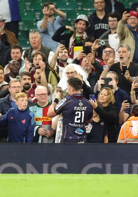 240525 - Northampton Saints v Union Bordeaux-Begles, EPCR Champions Cup Final - Marko Gazzotti of Union Bordeaux-Begles lifts the trophy as he celebrates with fans