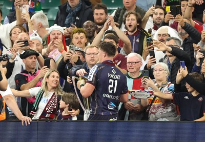 240525 - Northampton Saints v Union Bordeaux-Begles, EPCR Champions Cup Final - Marko Gazzotti of Union Bordeaux-Begles lifts the trophy as he celebrates with fans