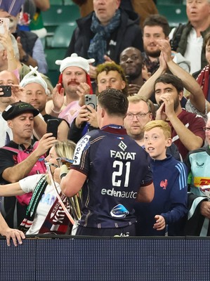 240525 - Northampton Saints v Union Bordeaux-Begles, EPCR Champions Cup Final - Marko Gazzotti of Union Bordeaux-Begles lifts the trophy as he celebrates with fans