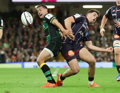 240525 - Northampton Saints v Union Bordeaux-Begles, EPCR Champions Cup Final - Alex Mitchell of Northampton Saints and Damian Penaud of Union Bordeaux-Begles compete for the ball