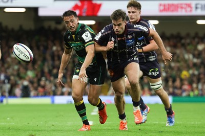 240525 - Northampton Saints v Union Bordeaux-Begles, EPCR Champions Cup Final - Alex Mitchell of Northampton Saints and Damian Penaud of Union Bordeaux-Begles compete for the ball