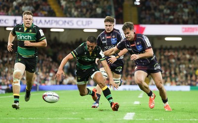 240525 - Northampton Saints v Union Bordeaux-Begles, EPCR Champions Cup Final - Alex Mitchell of Northampton Saints and Damian Penaud of Union Bordeaux-Begles compete for the ball