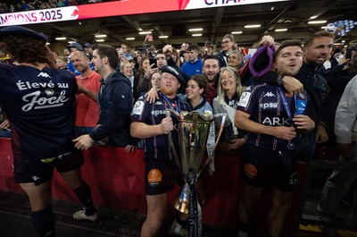 240525 - Northampton Saints v Union Bordeaux-Begles, EPCR Champions Cup Final - Union Bordeaux-Begles players celebrate with the trophy and fans