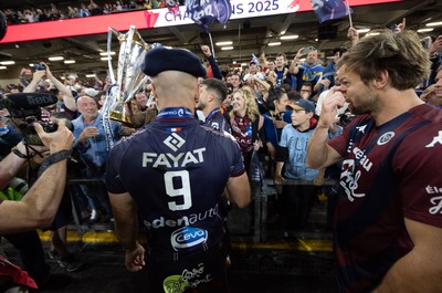 240525 - Northampton Saints v Union Bordeaux-Begles, EPCR Champions Cup Final - Maxime Lucu of Union Bordeaux-Begles celebrates with the trophy and fans