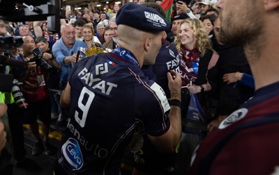 240525 - Northampton Saints v Union Bordeaux-Begles, EPCR Champions Cup Final - Maxime Lucu of Union Bordeaux-Begles celebrates with the trophy and fans