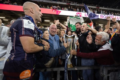 240525 - Northampton Saints v Union Bordeaux-Begles, EPCR Champions Cup Final - Maxime Lucu of Union Bordeaux-Begles celebrates with the trophy and fans