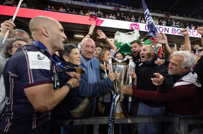 240525 - Northampton Saints v Union Bordeaux-Begles, EPCR Champions Cup Final - Maxime Lucu of Union Bordeaux-Begles celebrates with the trophy and fans