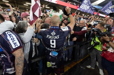 240525 - Northampton Saints v Union Bordeaux-Begles, EPCR Champions Cup Final - Maxime Lucu of Union Bordeaux-Begles celebrates with the trophy and fans