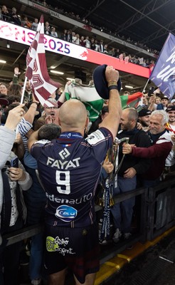 240525 - Northampton Saints v Union Bordeaux-Begles, EPCR Champions Cup Final - Maxime Lucu of Union Bordeaux-Begles celebrates with the trophy and fans
