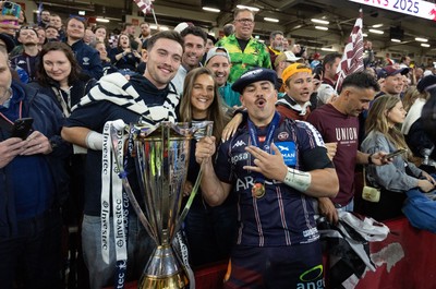 240525 - Northampton Saints v Union Bordeaux-Begles, EPCR Champions Cup Final - Union Bordeaux-Begles players celebrate with the trophy and fans