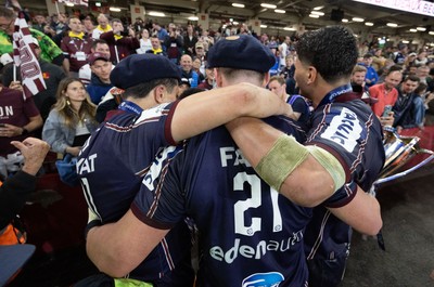 240525 - Northampton Saints v Union Bordeaux-Begles, EPCR Champions Cup Final - Union Bordeaux-Begles players celebrate with the trophy and fans