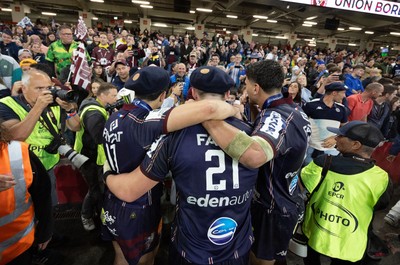 240525 - Northampton Saints v Union Bordeaux-Begles, EPCR Champions Cup Final - Union Bordeaux-Begles players celebrate with the trophy and fans