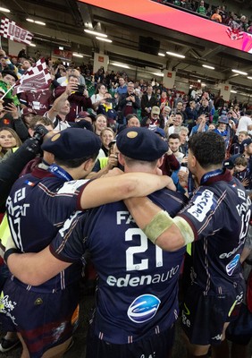 240525 - Northampton Saints v Union Bordeaux-Begles, EPCR Champions Cup Final - Union Bordeaux-Begles players celebrate with the trophy and fans