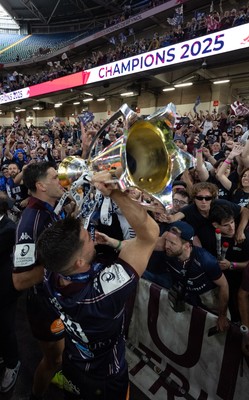 240525 - Northampton Saints v Union Bordeaux-Begles, EPCR Champions Cup Final - Matthieu Jalibert of Union Bordeaux-Begles celebrates with the trophy and fans