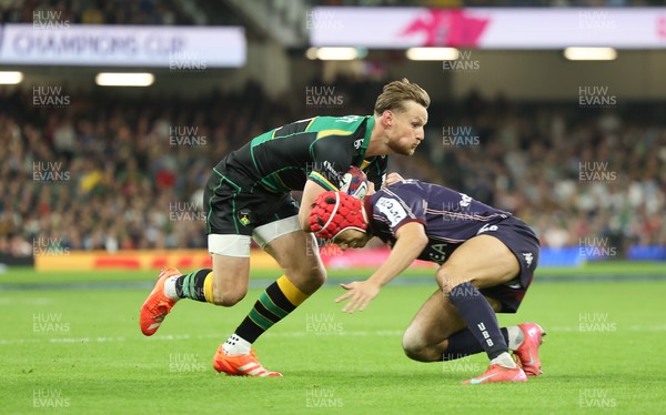 240525 - Northampton Saints v Union Bordeaux-Begles, EPCR Champions Cup Final - Rory Hutchinson of Northampton Saints is tackled by Louis Bielle-Biarrey of Union Bordeaux-Begles