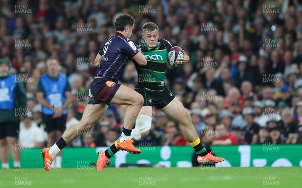 240525 - Northampton Saints v Union Bordeaux-Begles, EPCR Champions Cup Final - Tom Litchfield of Northampton Saints takes on Damian Penaud of Union Bordeaux-Begles