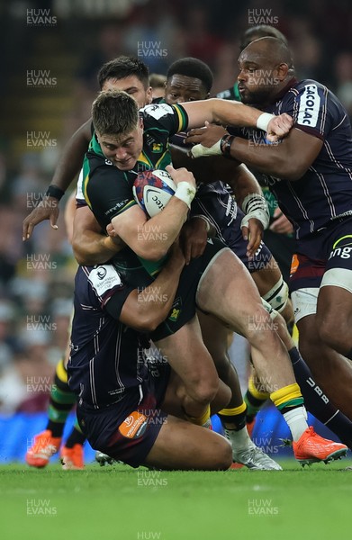 240525 - Northampton Saints v Union Bordeaux-Begles, EPCR Champions Cup Final - Tommy Freeman of Northampton Saints is tackled