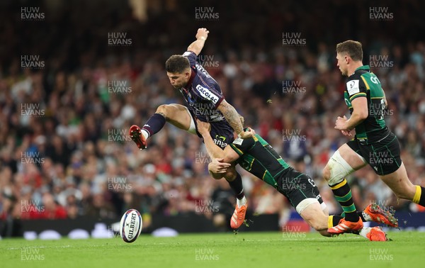 240525 - Northampton Saints v Union Bordeaux-Begles, EPCR Champions Cup Final - Matthieu Jalibert of Union Bordeaux-Begles is tackled as he goes to kick