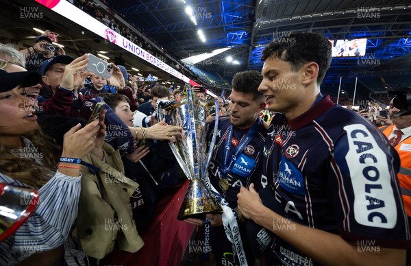 240525 - Northampton Saints v Union Bordeaux-Begles, EPCR Champions Cup Final - Matthieu Jalibert of Union Bordeaux-Begles celebrates with the trophy as they win the Investec Champions Cup