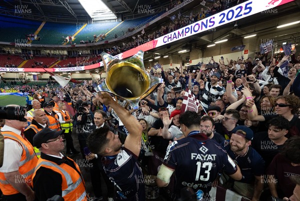 240525 - Northampton Saints v Union Bordeaux-Begles, EPCR Champions Cup Final - Matthieu Jalibert of Union Bordeaux-Begles celebrates with the trophy and fans as they win the Investec Champions Cup