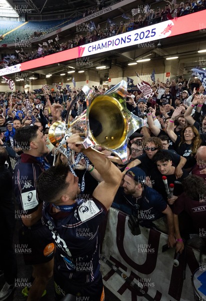 240525 - Northampton Saints v Union Bordeaux-Begles, EPCR Champions Cup Final - Matthieu Jalibert of Union Bordeaux-Begles celebrates with the trophy and fans as they win the Investec Champions Cup